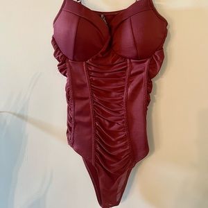 Mauve berry runched bodysuit. Button enclosure. Adjustable straps